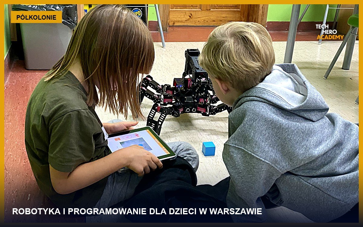 Półkolonie z robotyką i programowaniem w Tech Hero Academy — dzieci pracują nad robotem