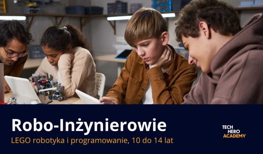 Uczniowie z trenerem przy robocie LEGO na zajeciach Robo-Inzynierowie