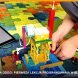Scratch dla dzieci: pierwsza lekcja programowania w blokach, tablet z kodem w blokach i robot z klocków na zajęciach Tech Hero Academy