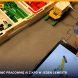 Skrzynka klocków LEGO Education, konstrukcja z silnikiem i tablet z instrukcją budowy na zajęciach, dłoń dziecka wskazuje ekran